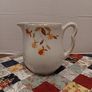 White Ceramic Floral Pitcher with Yellow and Orange Accents
